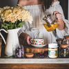 Woman pouring green tea with herbs